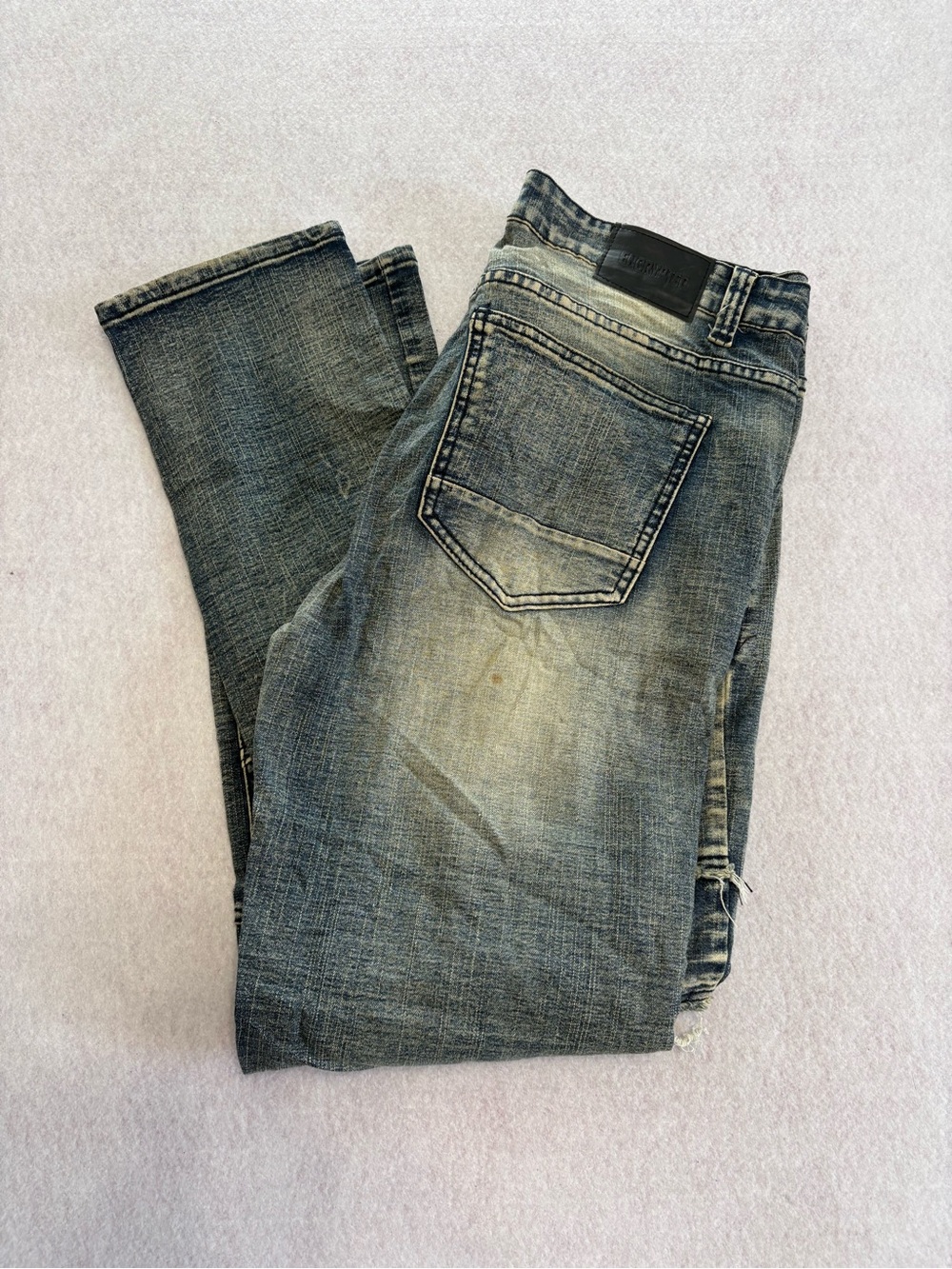 Encrypted men’s jeans distressed medium wash faded Y2K grunge